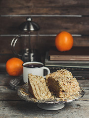 cake - Napoleon (puff cake with white cream) on a wooden table