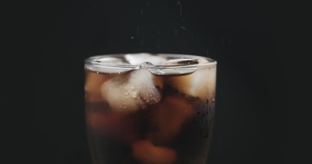 closeup cola in glass with ice