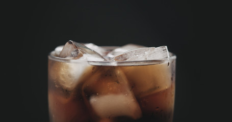 closeup cola in glass with ice
