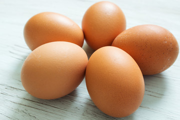 Easter decor. Colored easter eggs on a wooden board. Close-up.