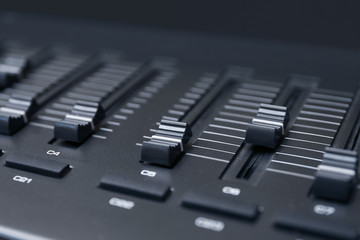 Multi-channel mixer at radio station, closeup