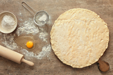 Raw dough for croissants on table