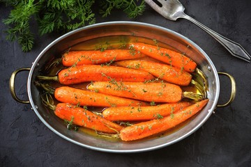 Organic carrots with thyme glazed in orange-honey sauce.