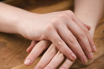 teen girl applying hand cream