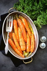 Organic carrots with thyme glazed in orange-honey sauce.