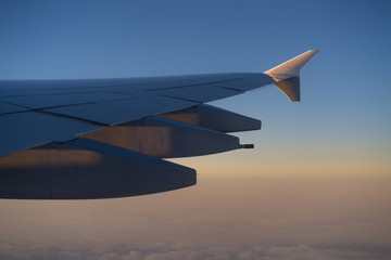 view of airplane wing during morning flight