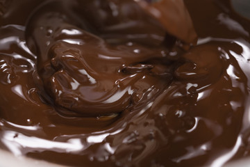 melting dark chocolate in steel bowl