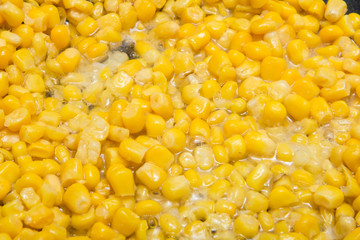 closeup corn fry in oil on a frying pan