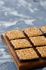 Top view close-up picture of tasty cookies on the cutting board, shallow depth of field, selective focus