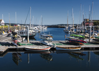 Pt Hudson Marina Scene Port Townsen WA with row boats, sail boats and blue sky