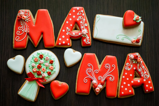 homemade cookies for mother's day, flowers, greeting card on wooden background