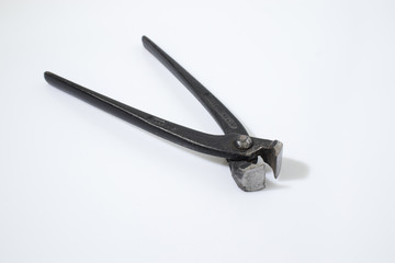 Pincer tool in a white backgorund compsoition