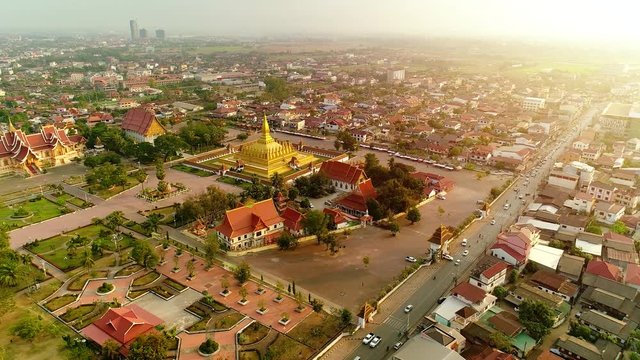  4k Video shot aerial view by drone of Wat Phra That Luang , Vientiane, Laos PDR. sunrise on Lao landmark temple.