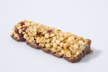 Cereal bar  whit fruit and chocolate in a white background