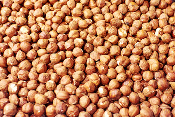 Hazelnut Background. Heap of peeled hazelnuts.