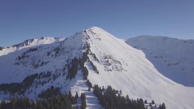 4K flat aerial view of praz de lys ski station in the French Alps in France - Log 