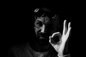 tattoo on the face,  man with a tattoo,  brutal bearded guy, studio portrait of a man