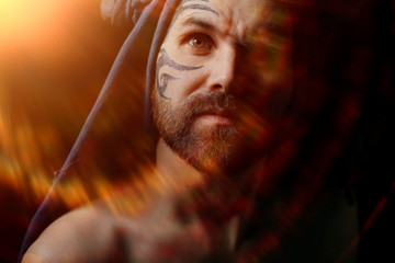 tattoo on the face,  man with a tattoo,  brutal bearded guy, studio portrait of a man