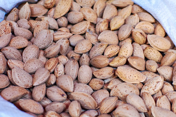 Shelled almonds as background. Close up view of shelled almonds texture and background for designers.