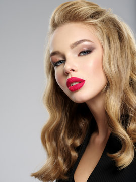 beautiful young blond girl with sexy red lips.