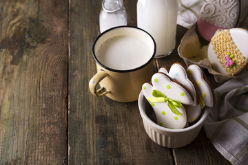 Rabbit shaped Easter cookies with milk. Decorated with fondant icing.