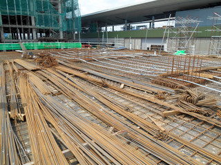 Steel reinforcement bar at the construction site. It uses to strengthen concrete. It is shaped follow the engineering design and tied together using tiny wire. 