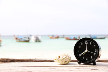 alarm clock On the beach Copy space