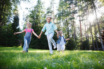 Children running in park