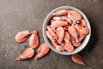 Frozen shrimps in rustic bowl