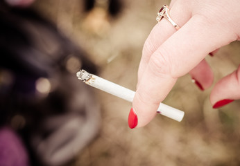 woman's hand with a cigarette