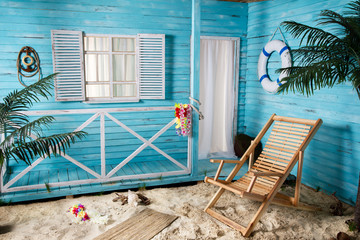 Indoor room with deck chair sand beach like blue house wooden bungalow with palms 