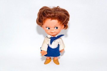 Toy doll made of fabric and safe plastic for children's games
