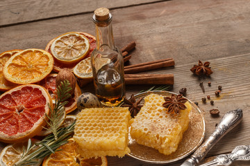 Honey, spices and dried fruits on a rustic table. Ingredients.