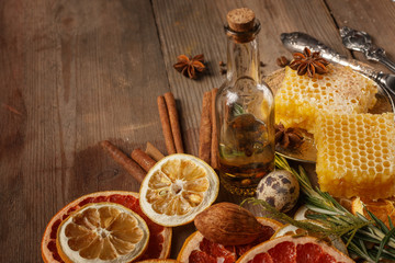 Honey, spices and dried fruits on a rustic table. Ingredients.