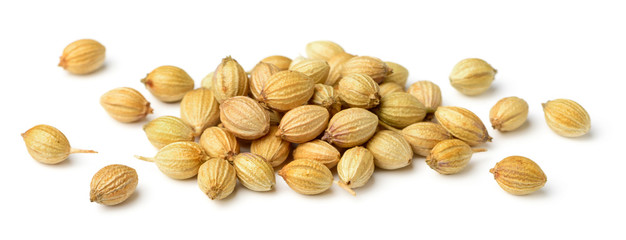 close up of dried coriander seeds isolated on white