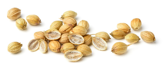 close up of dried coriander seeds isolated on white