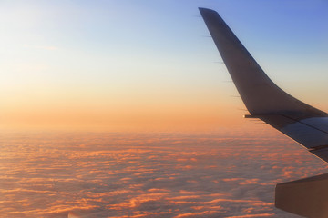 Obraz premium view from the airplane window at dawn during the flight