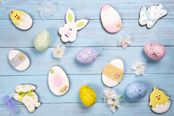Fototapeta na wymiar Easter background. Cookies in shape of Easter eggs and Easter bunny.