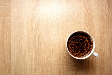 Coffee cup on rustic wooden table background, copy space for your object or text