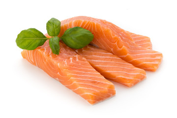 Fresh salmon fillet with basil on the white background.