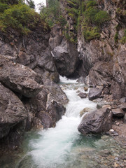 Mountain river in the rocks, waterfall.
