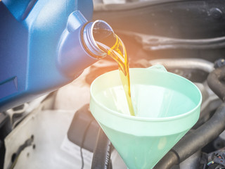 Mechanic change engine oil to preserve engine life,  maintenance concept