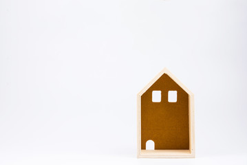 Wooden house toy on white background with copy space.Real estate concept, New house concept, Finance loan business concept.