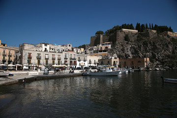Fototapeta na wymiar Aeolian (Lipari) archipelago, Italy. Picturesque view of the port and the citadel in Lipari on a sunny afternoon