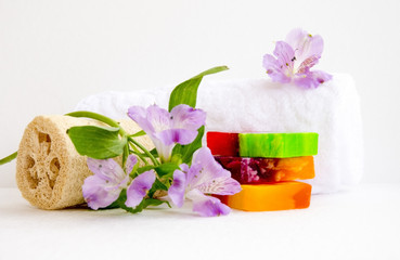 bathroom accessories, luff,  alstroemeria flower, handmade soap and white towel