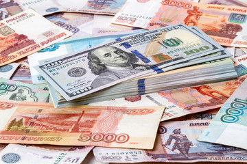 Fototapeta na wymiar Pack of dollars against the background Russian money