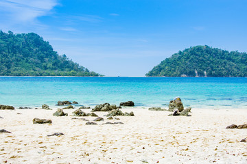 two mountain and blue sea