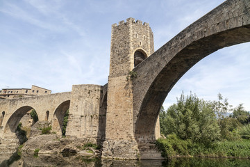 Fototapeta na wymiar Ancient bridge, romanesque style in medieval village of Besalu, Garrotxa comarca, province Girona,Catalonia.Spain.