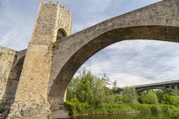 Ancient bridge, romanesque style in medieval village of  Besalu, Garrotxa comarca, province Girona,Catalonia.Spain.
