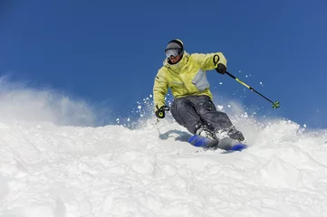Photo sur Plexiglas Sports dhiver Bearded skier running down the mountain slope in resort of Gudauri, Georgia